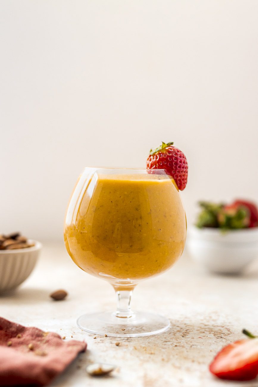 sweet potato protein smoothie decorated with strawberries