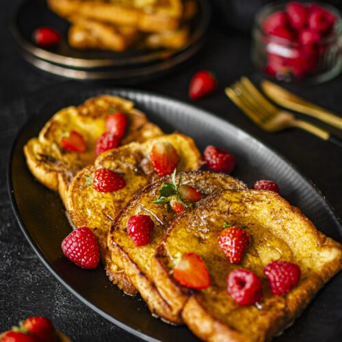 easy eggy bread served with strawberries, raspberries and maple syrup