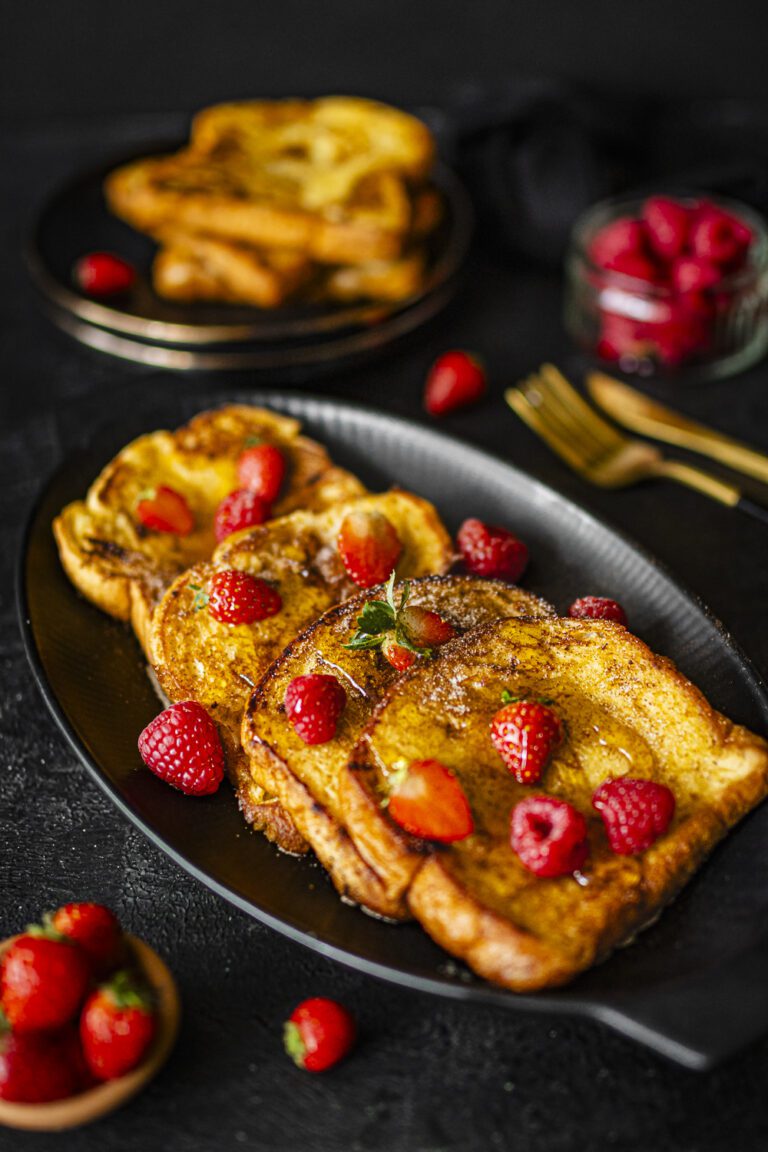 easy French toast served with strawberries, raspberries and maple syrup